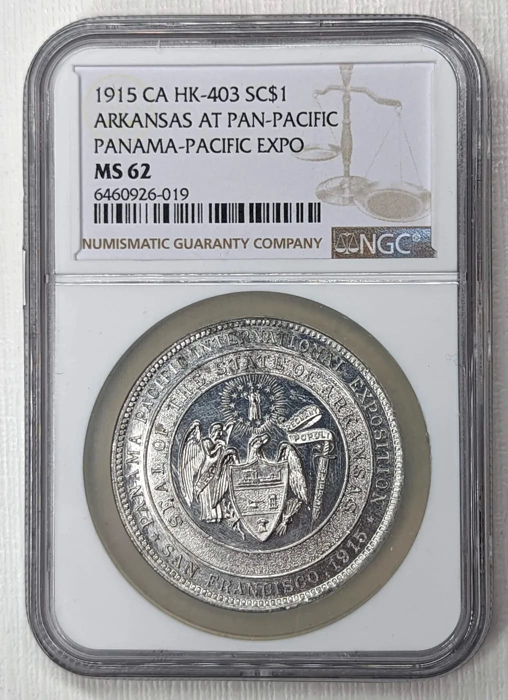 1915 Panama-Pacific Exposition Arkansas so-called dollar, HK-403, in an NGC MS62 holder